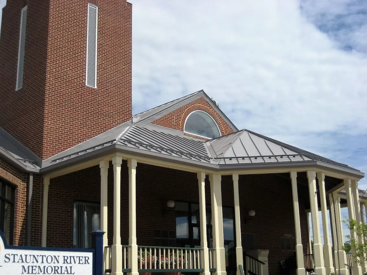 Skilled roofing craftsmen working on a residential roof in Belle Center